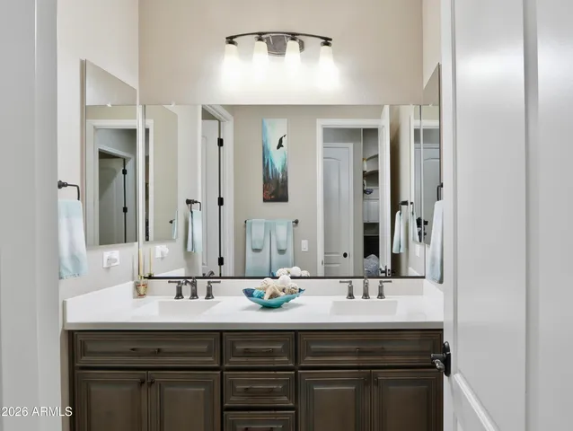 a front view of a house with yard and trees