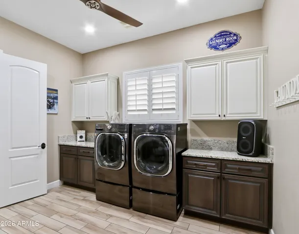 a view of a house with a yard patio and swimming pool
