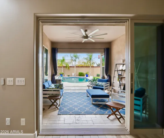 an aerial view of a house with a swimming pool yard and outdoor seating