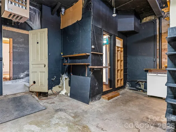 a room with table and chairs