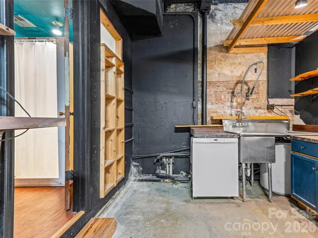 an aerial view of residential house and sandy dunes