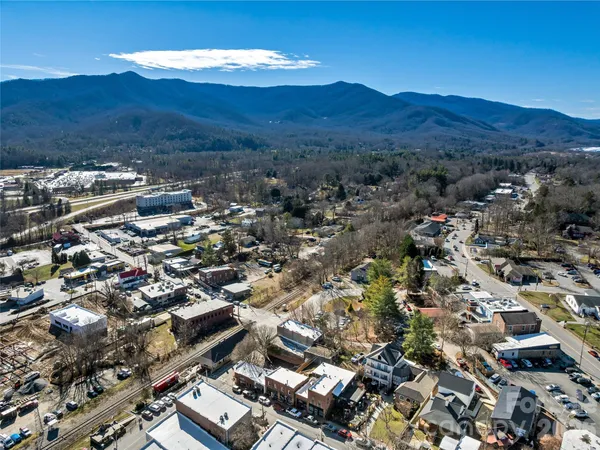 an aerial view of a backyard with seating space