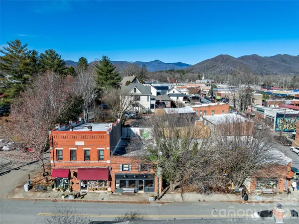 an aerial view of residential house and green space