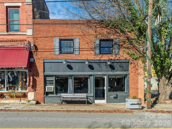 a backyard of a house with large trees
