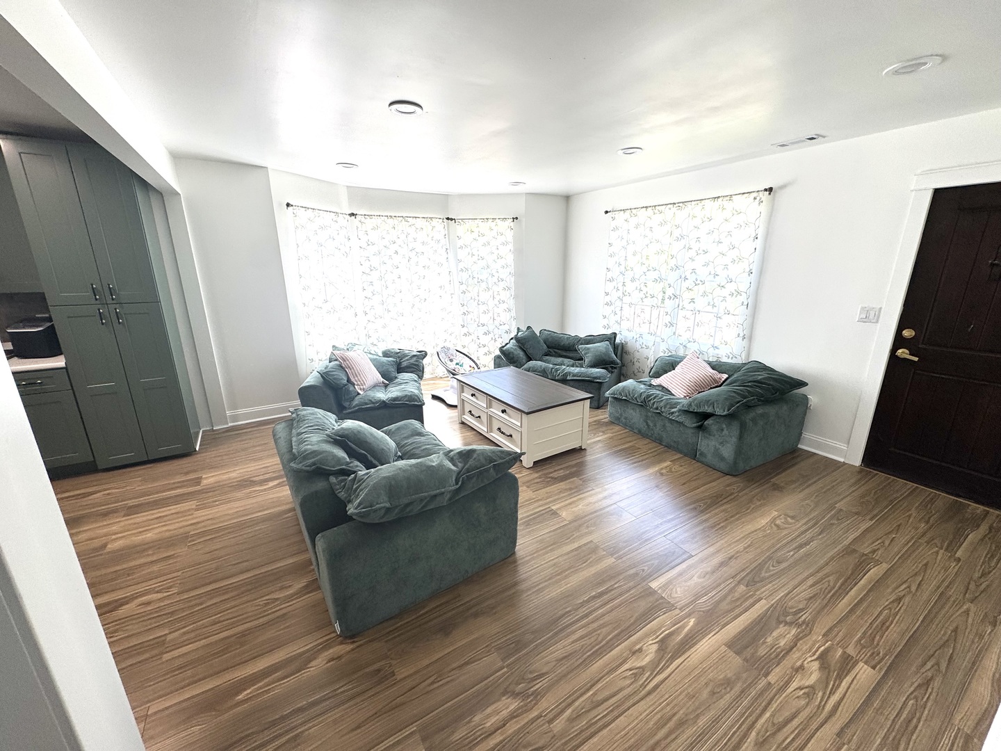 931 South Rawson Bridge Road Cary, IL 60013 - Photo 9 of 36 a living room with furniture and a flat screen tv