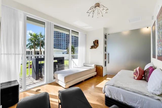 a view of a swimming pool with a patio and a garden