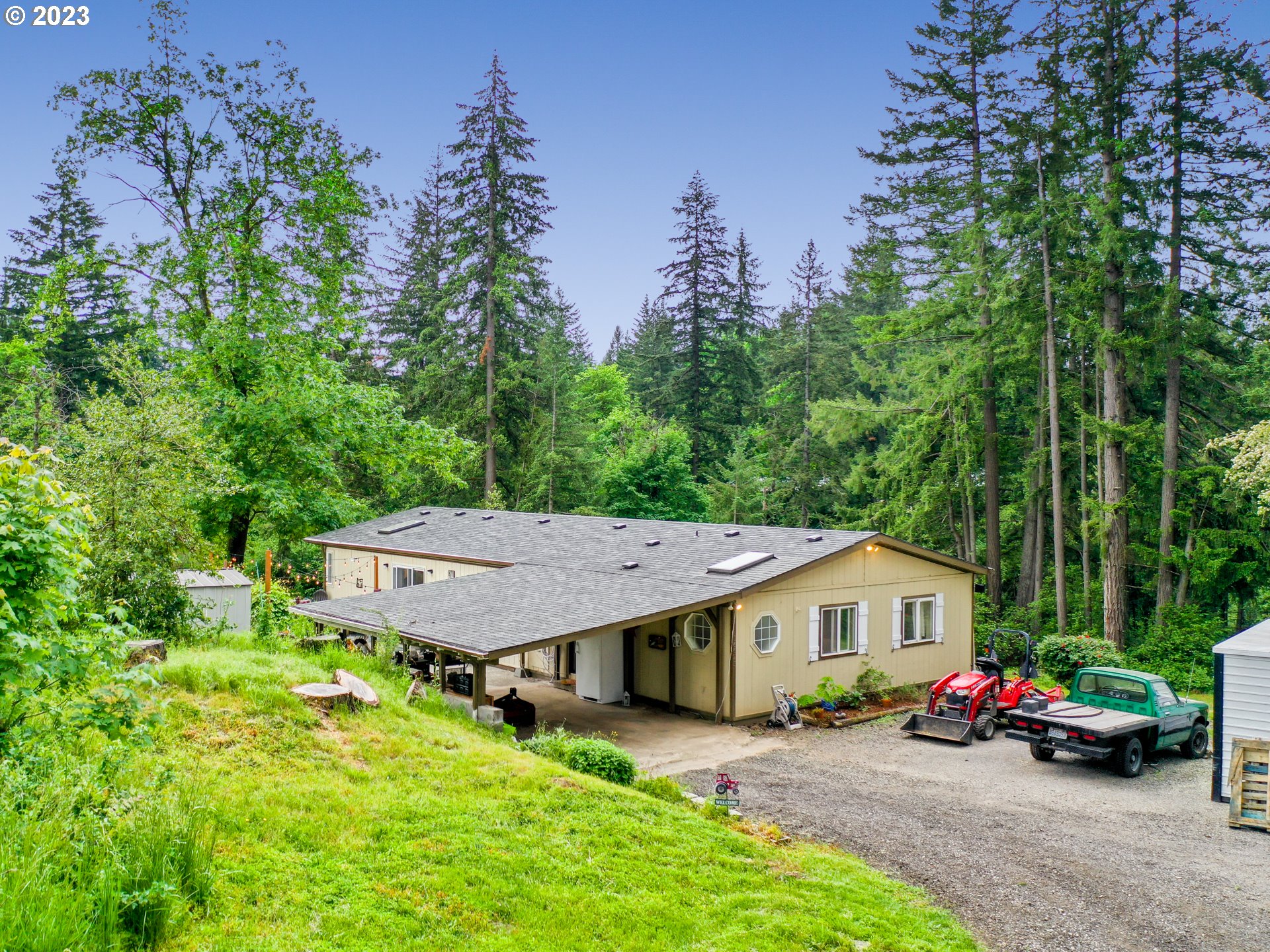 16625 South Redland Road Oregon City, OR 97045 - Photo 1 of 28 an aerial view of a house with swimming pool and garden