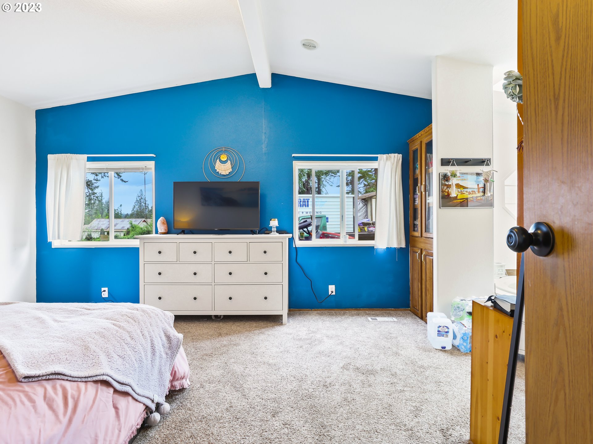 16625 South Redland Road Oregon City, OR 97045 - Photo 13 of 28 a bedroom with a bed and a flat screen tv