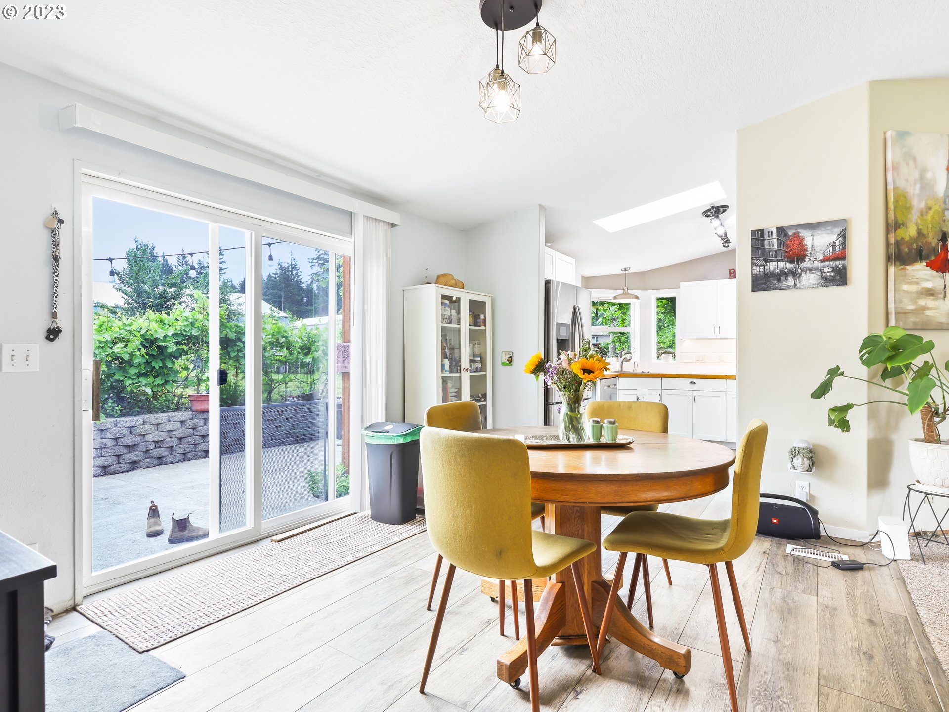 16625 South Redland Road Oregon City, OR 97045 - Photo 7 of 28 a dining room with furniture a window and wooden floor