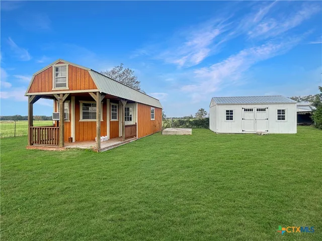 a view of a house with a big yard