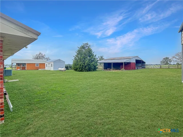 a view of house with a garden