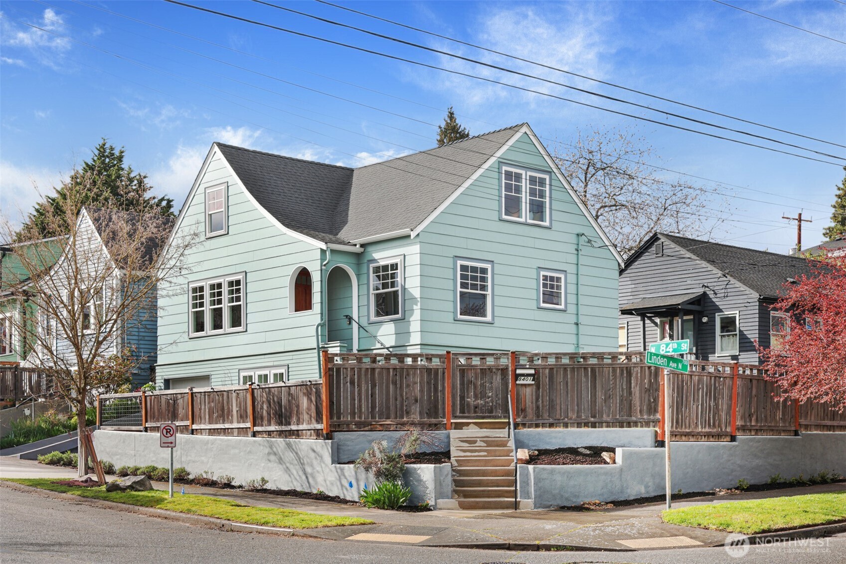 8401 Linden Avenue North Seattle, WA 98103 - Photo 1 of 36 a front view of a house with a yard