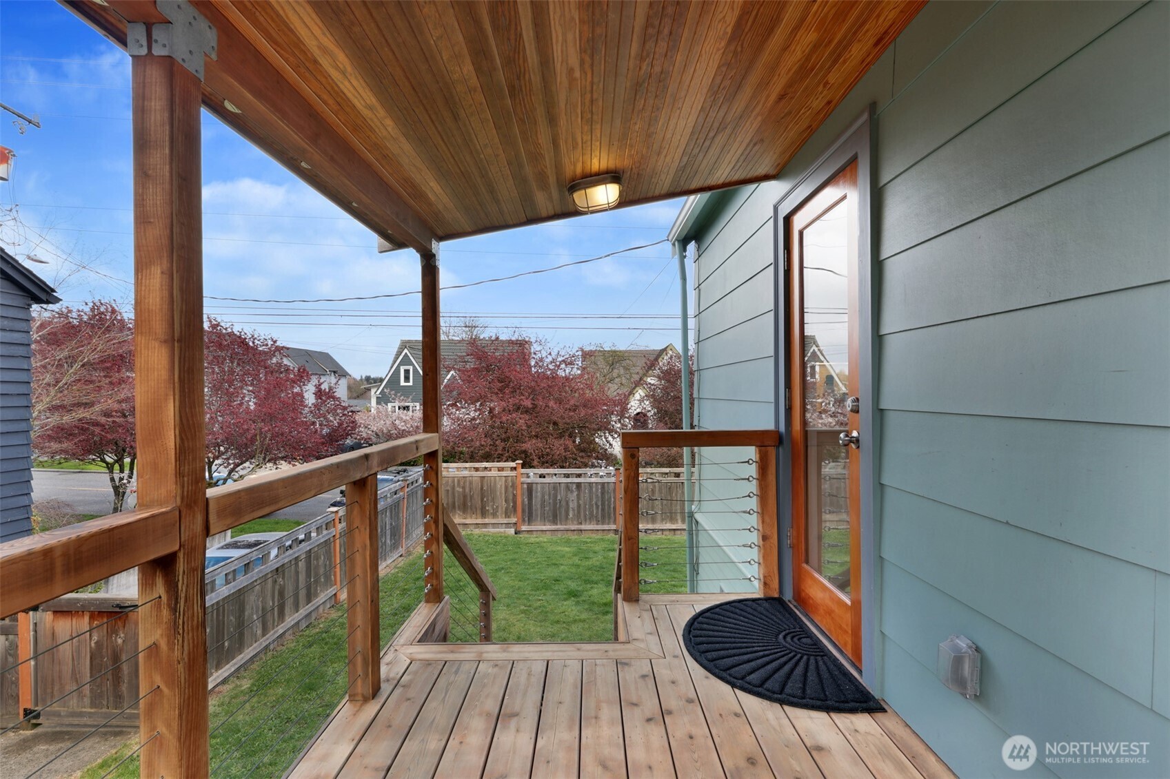 8401 Linden Avenue North Seattle, WA 98103 - Photo 16 of 36 a view of balcony with a floor to ceiling window with wooden floor