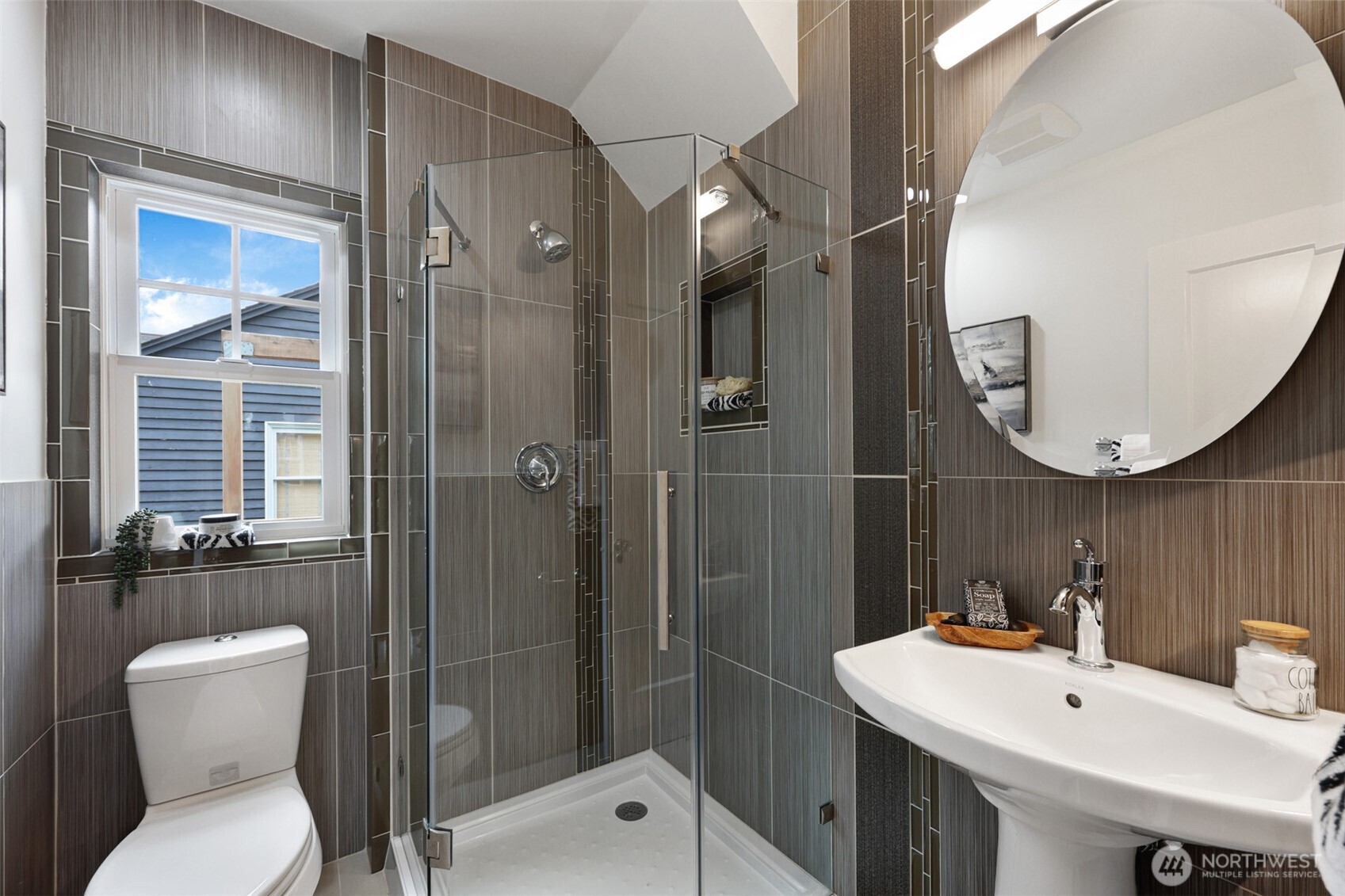 8401 Linden Avenue North Seattle, WA 98103 - Photo 19 of 36 a bathroom with a sink toilet and shower