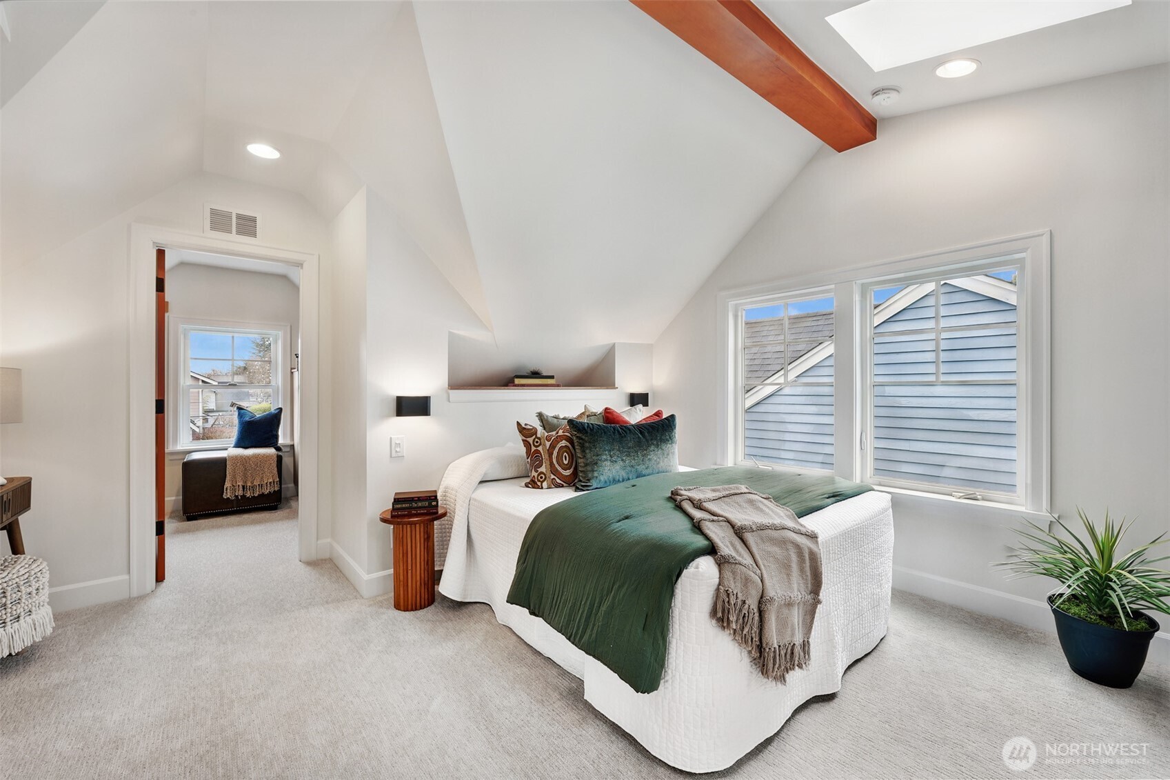 8401 Linden Avenue North Seattle, WA 98103 - Photo 22 of 36 a bedroom with bed and a potted plant