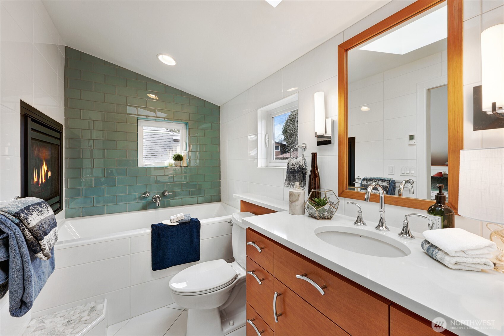 8401 Linden Avenue North Seattle, WA 98103 - Photo 24 of 36 a bathroom with a granite countertop sink and a mirror