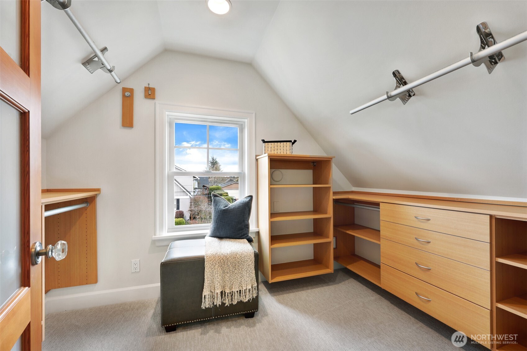 8401 Linden Avenue North Seattle, WA 98103 - Photo 25 of 36 a bedroom with a bed and a cabinets
