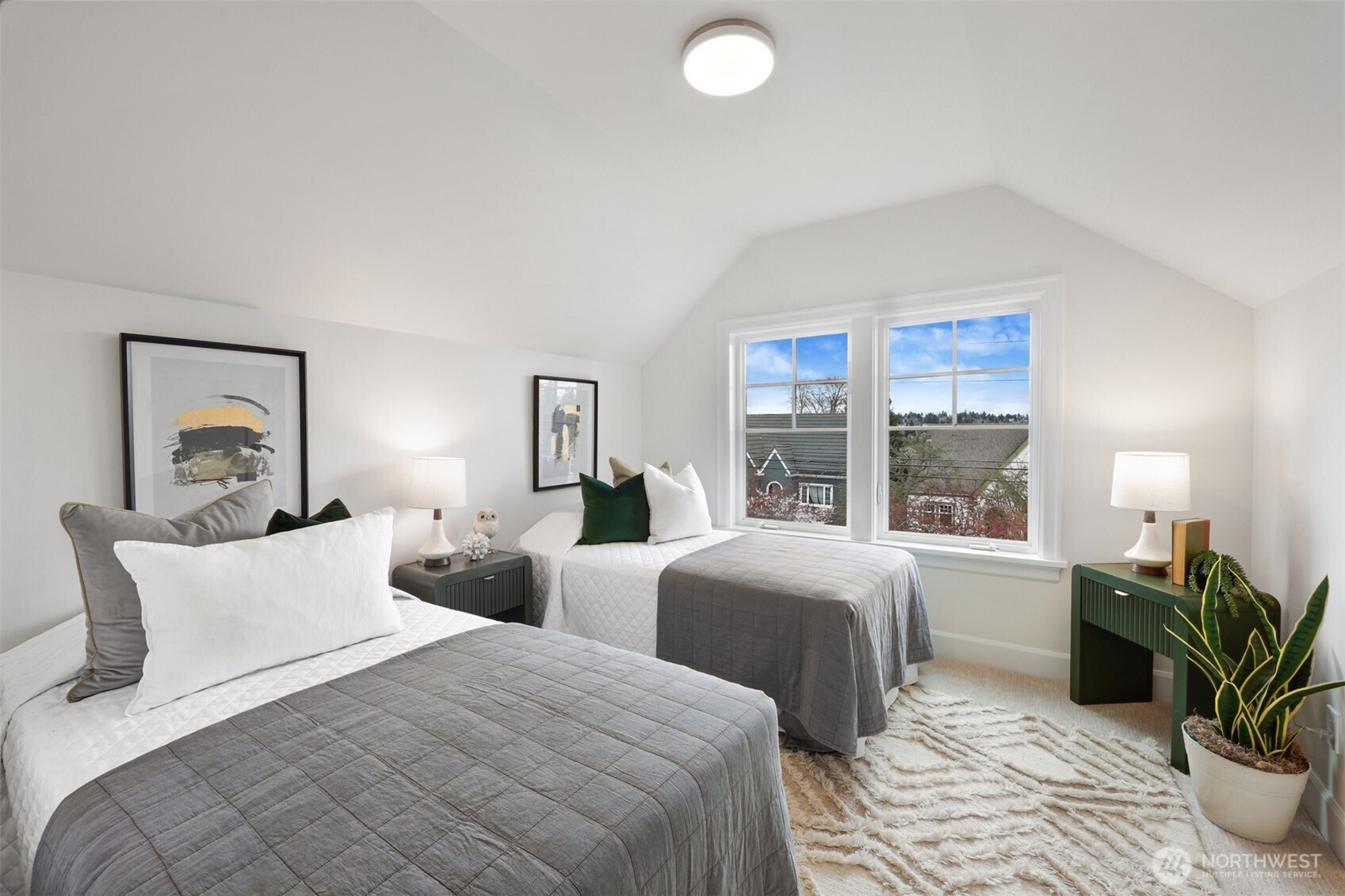 8401 Linden Avenue North Seattle, WA 98103 - Photo 26 of 36 a bedroom with two beds and a potted plant