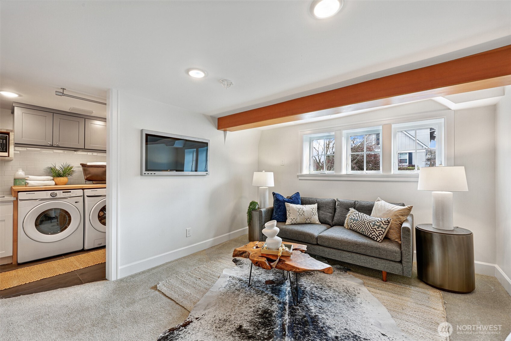 8401 Linden Avenue North Seattle, WA 98103 - Photo 27 of 36 a living room with furniture and a wooden floor