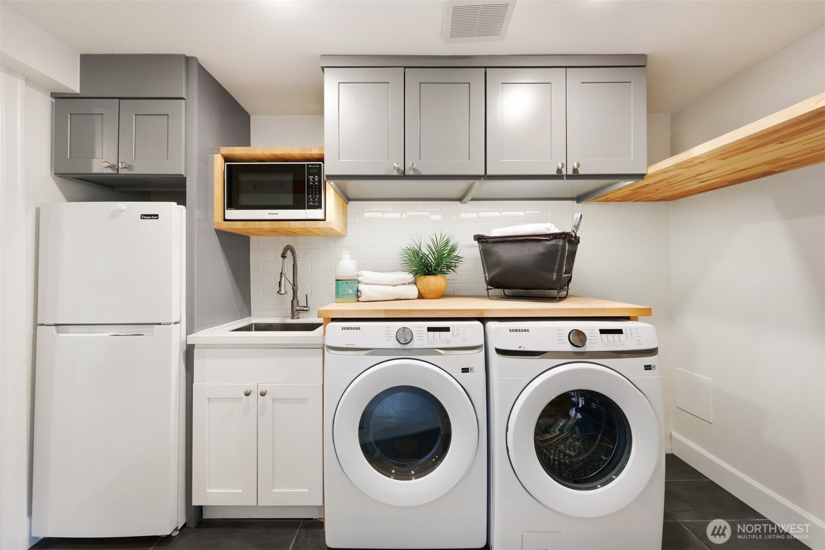 8401 Linden Avenue North Seattle, WA 98103 - Photo 32 of 36 a view of kitchen with washer and dryer