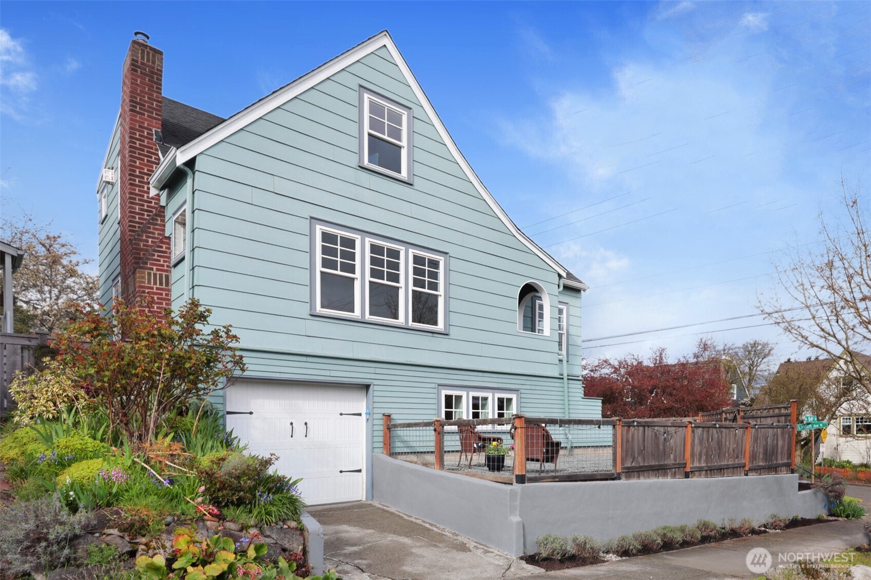 8401 Linden Avenue North Seattle, WA 98103 - Photo 33 of 36 a front view of a house with a yard