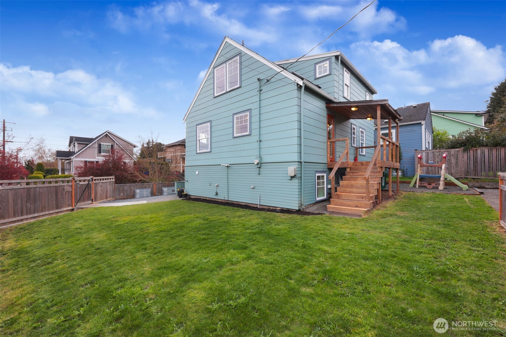 8401 Linden Avenue North Seattle, WA 98103 - Photo 36 of 36 a view of a house with a yard and a porch