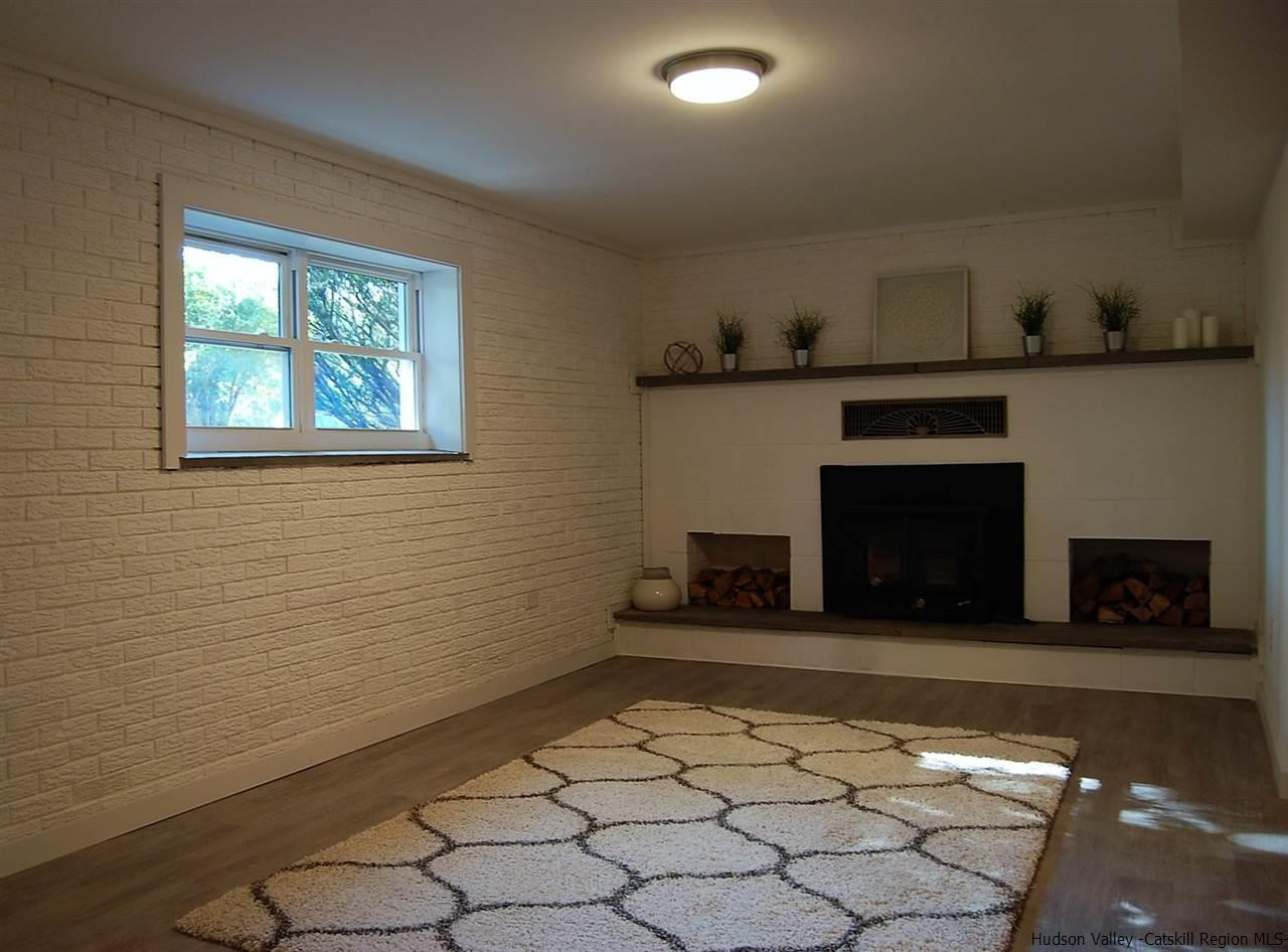 64 Mossybrook Road High Falls, NY 12440 - Photo 11 of 19 a view of a livingroom with an empty space and a fireplace