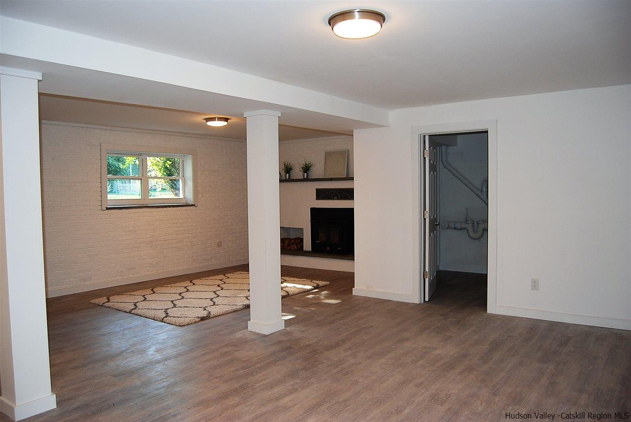 64 Mossybrook Road High Falls, NY 12440 - Photo 12 of 19 an empty room with wooden floor and windows