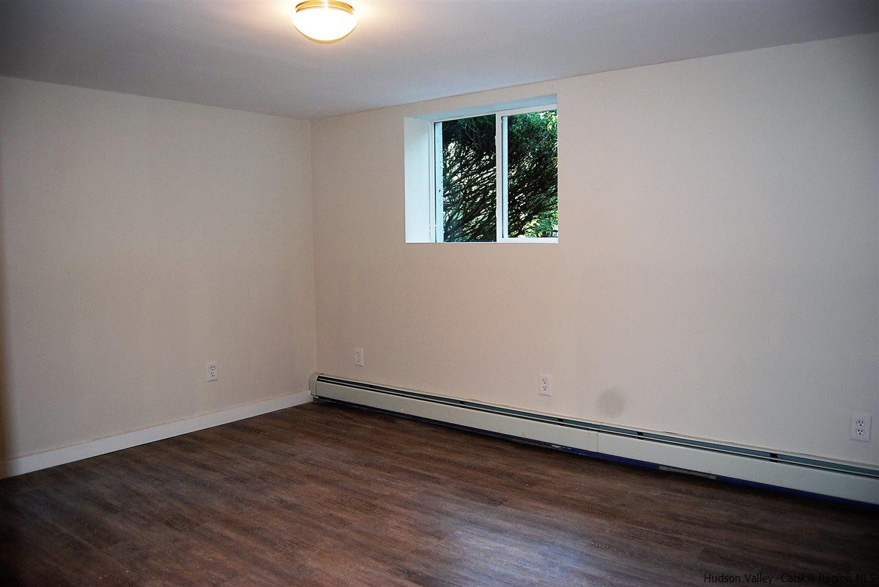 64 Mossybrook Road High Falls, NY 12440 - Photo 14 of 19 a view of an empty room with wooden floor and a window