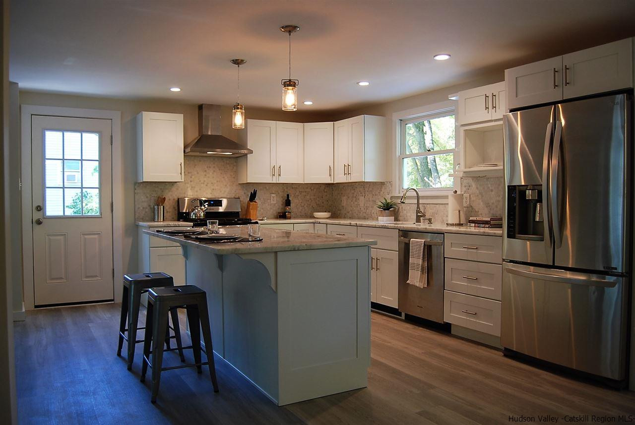 64 Mossybrook Road High Falls, NY 12440 - Photo 4 of 19 a kitchen with a refrigerator cabinets and wooden floor
