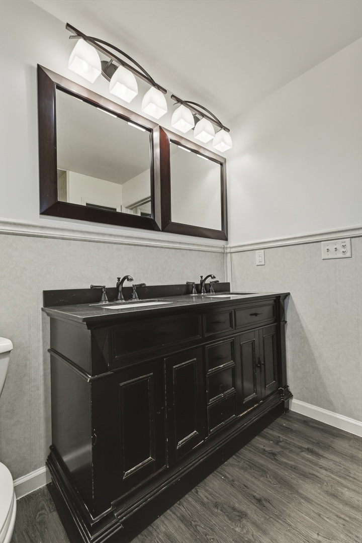 11622 27th Street West Milan, IL 61264 - Photo 32 of 49 a bathroom with a sink and a mirror