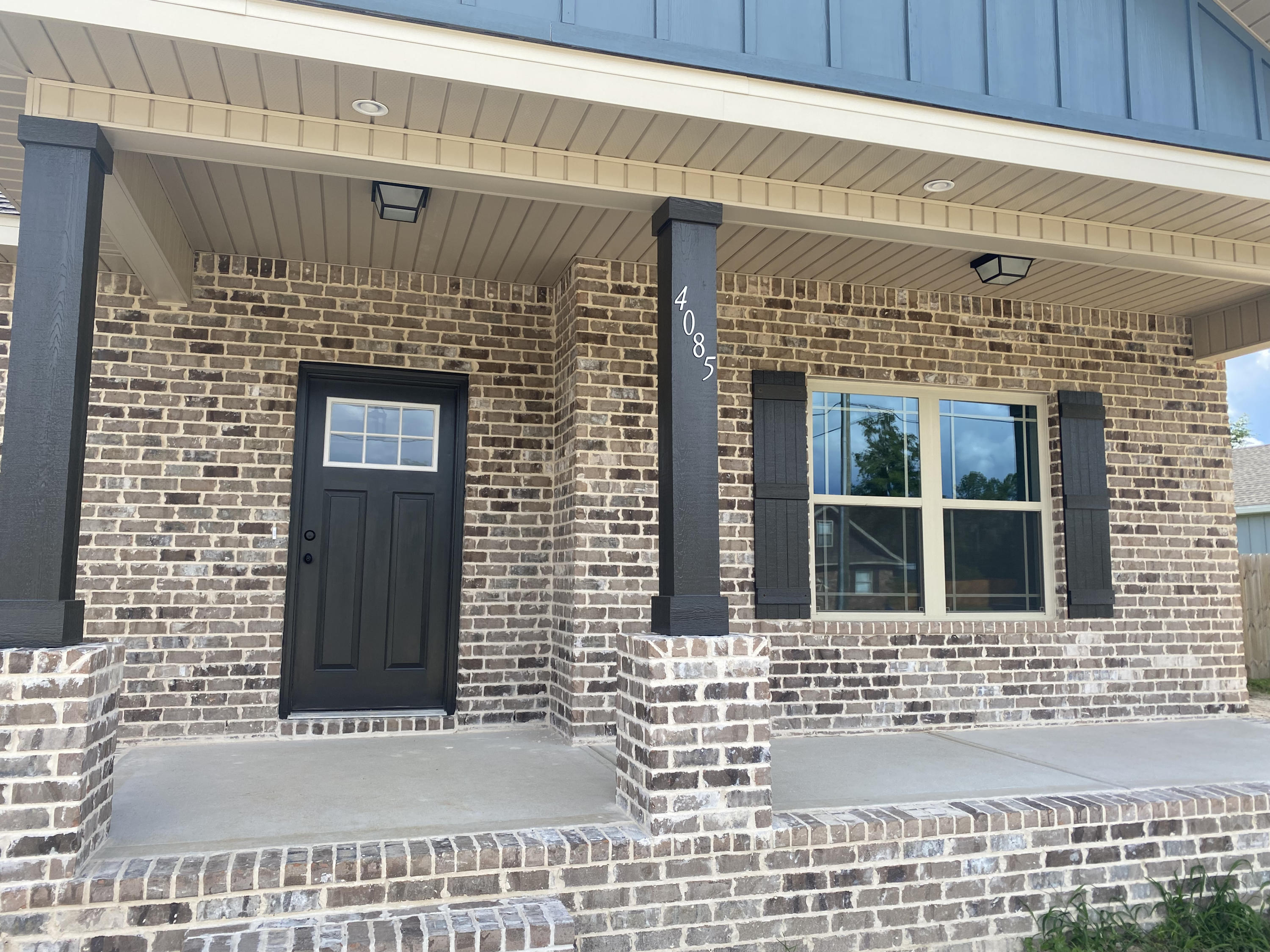 4085 Happy Trails Road Crestview, FL 32539 - Photo 2 of 19 a front view of a building with a glass door