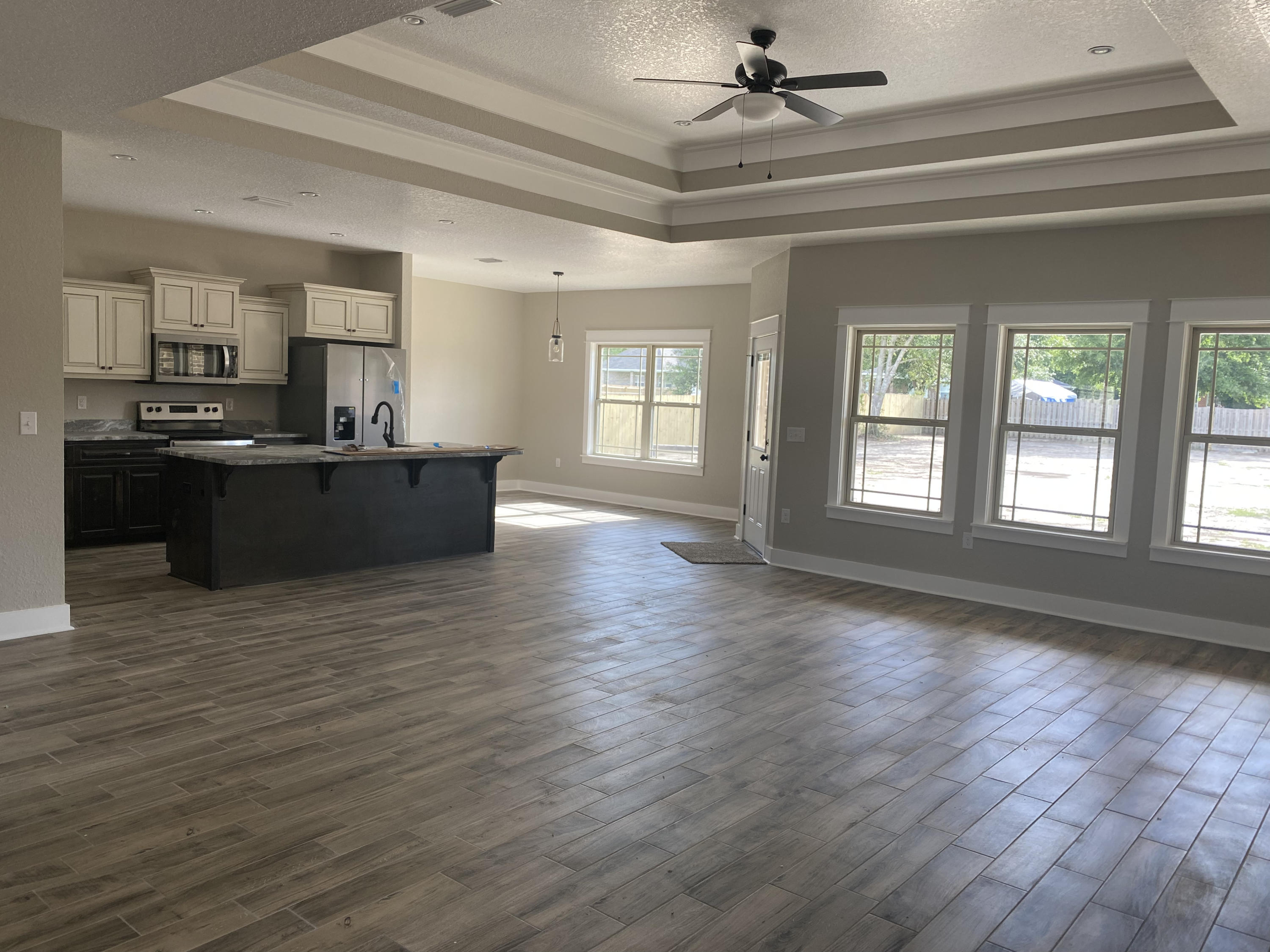 4085 Happy Trails Road Crestview, FL 32539 - Photo 3 of 19 a view of a living room a kitchen and windows