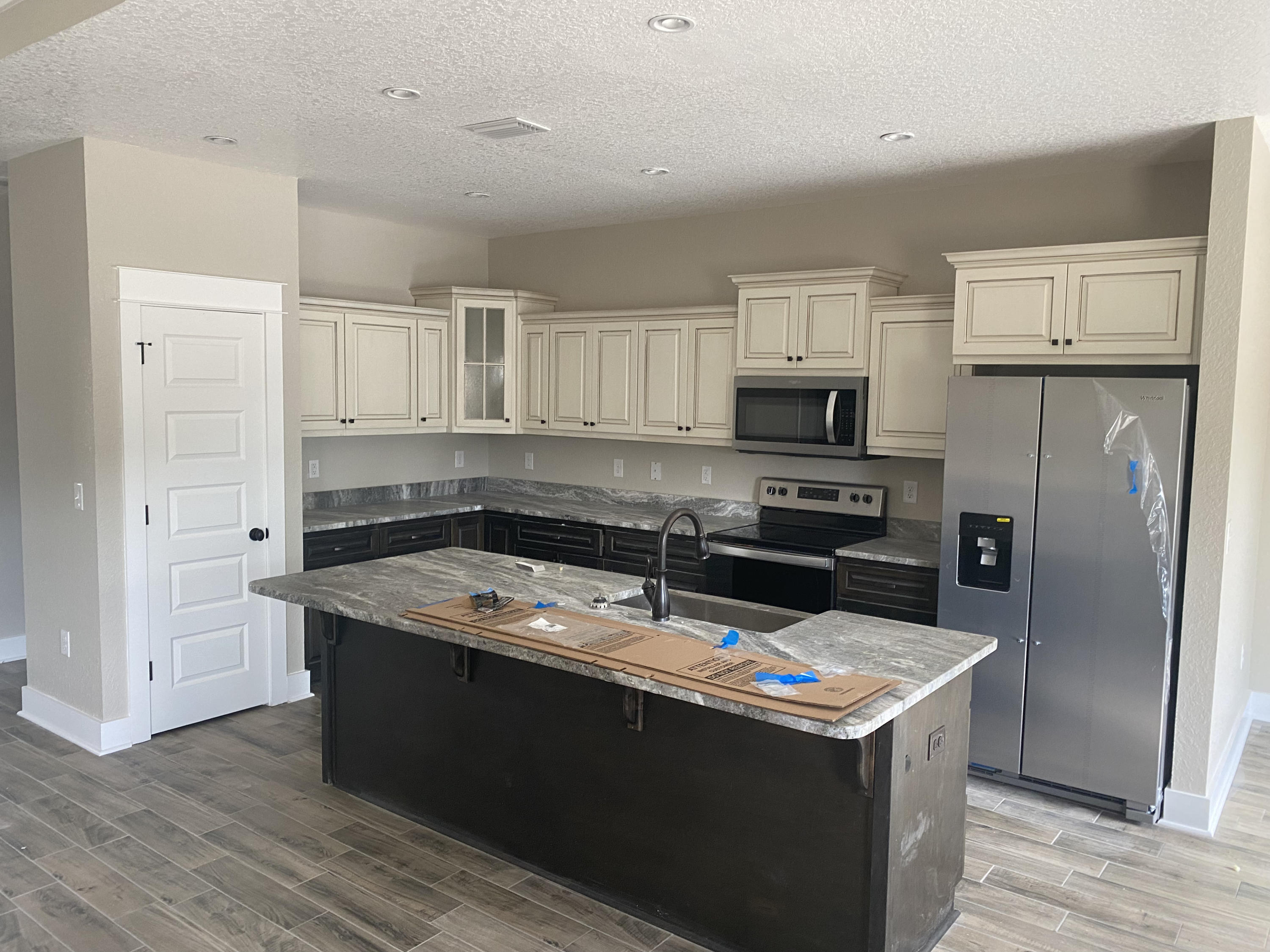 4085 Happy Trails Road Crestview, FL 32539 - Photo 4 of 19 a kitchen with granite countertop a sink stove and refrigerator
