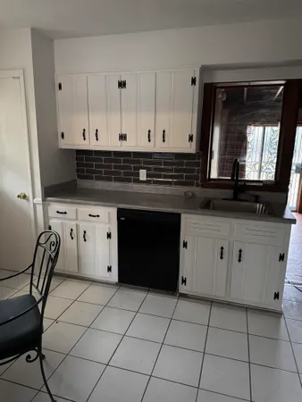 a kitchen with stainless steel appliances a stove a sink and a microwave