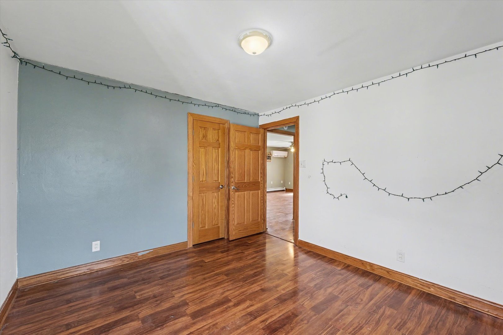 110 Highway 54 Roberts, IL 60962 - Photo 15 of 31 a view of an empty room with wooden floor