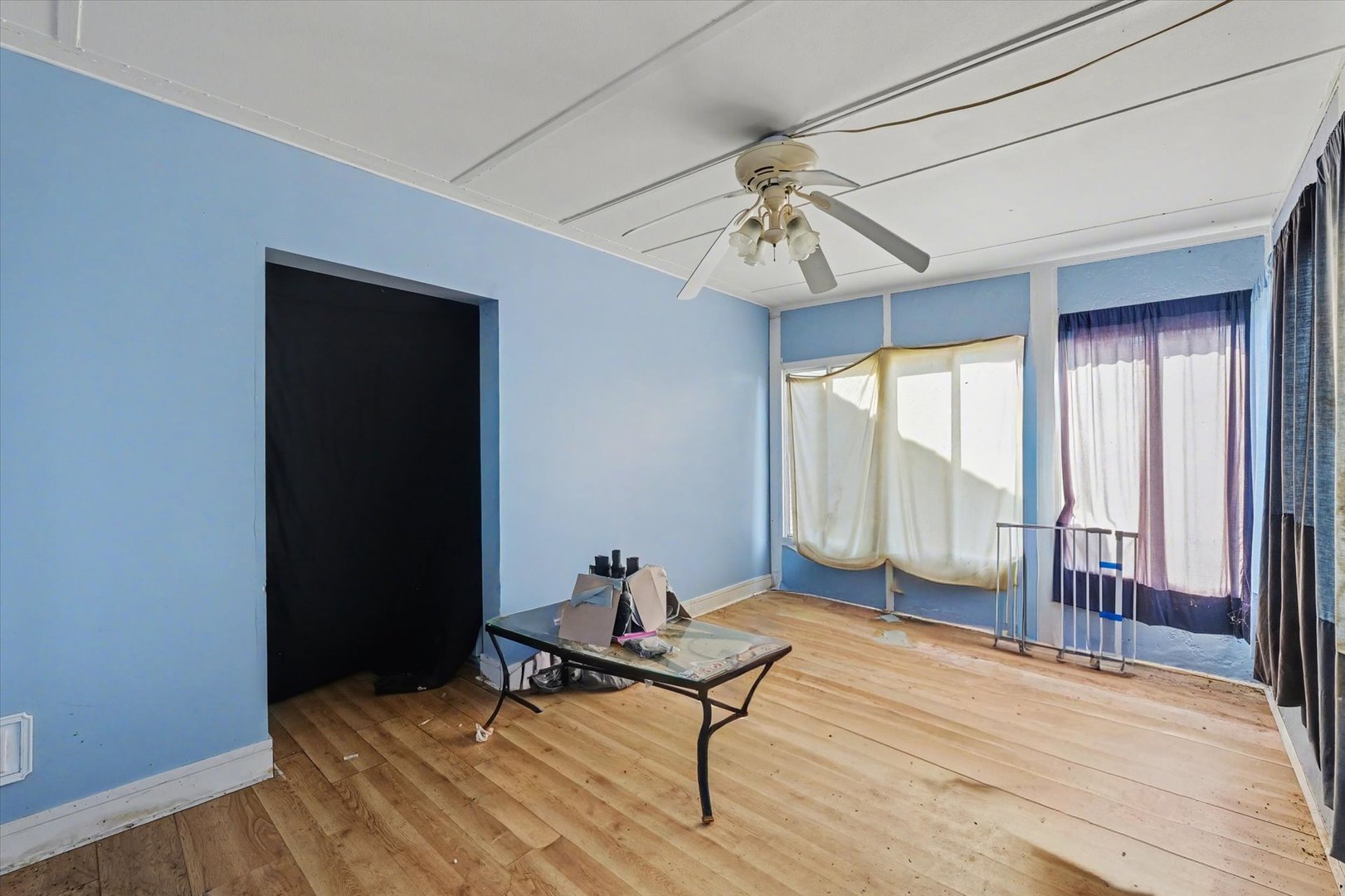 110 Highway 54 Roberts, IL 60962 - Photo 22 of 31 a living room with wooden floor and ceiling fan