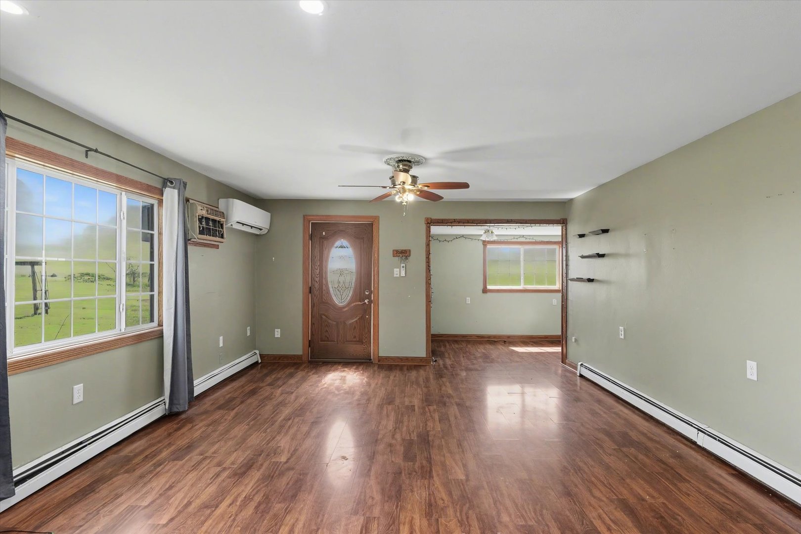 110 Highway 54 Roberts, IL 60962 - Photo 7 of 31 wooden floor in an empty room with a window