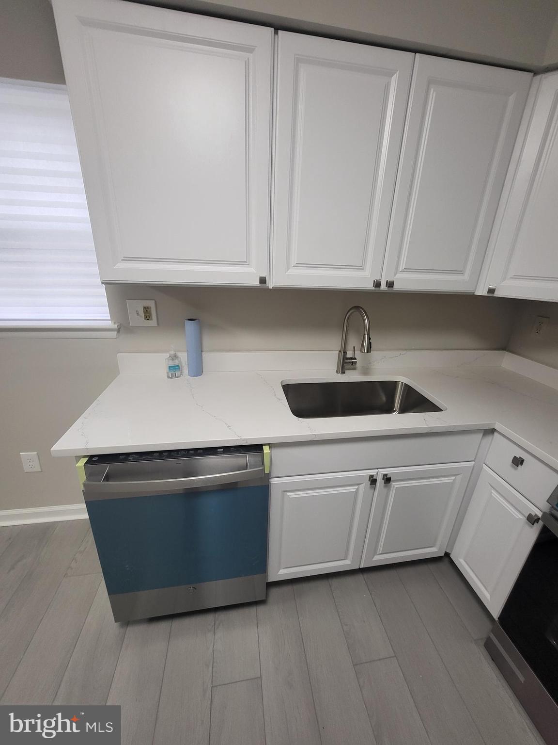 3203 Prince Ranier Place District Heights, MD 20747 - Photo 8 of 18 a kitchen with stainless steel appliances granite countertop a sink and a stove