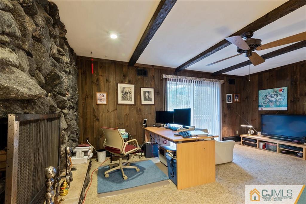 1 Winter Street Edison, NJ 08820 - Photo 14 of 36 a kitchen with stainless steel appliances kitchen island granite countertop a stove and a refrigerator
