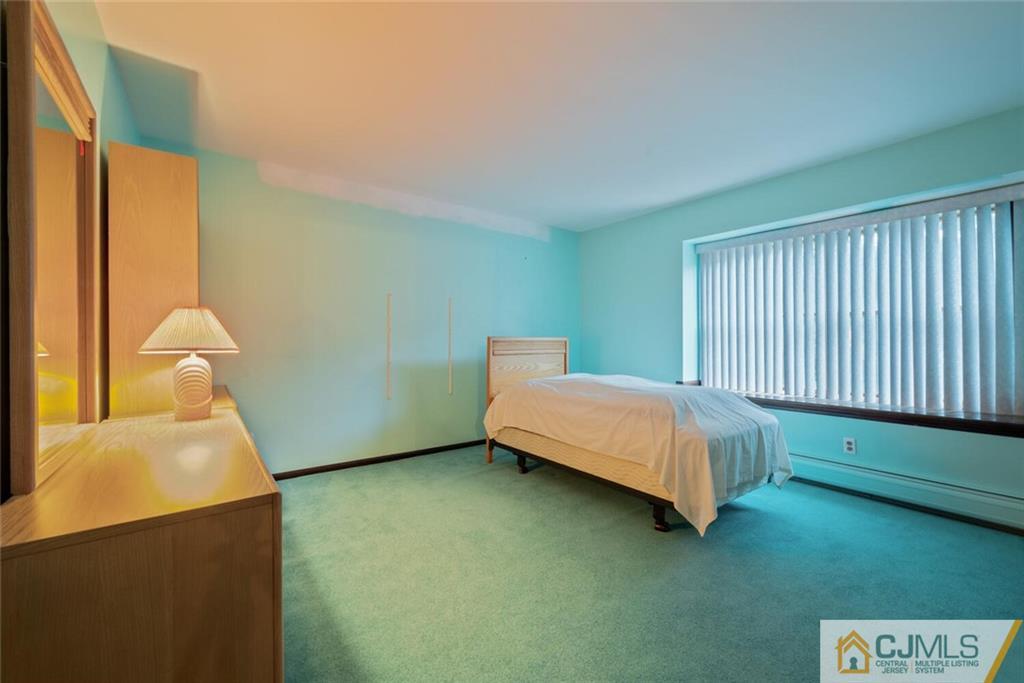 1 Winter Street Edison, NJ 08820 - Photo 29 of 36 a bedroom with a bed and window