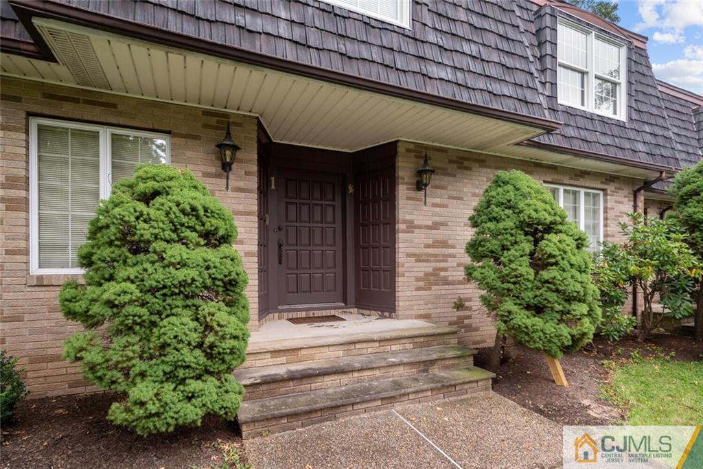 1 Winter Street Edison, NJ 08820 - Photo 4 of 36 a front view of a house with a garden