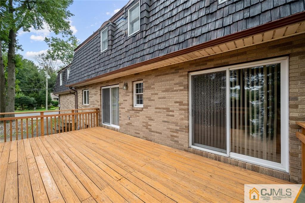 1 Winter Street Edison, NJ 08820 - Photo 34 of 36 a view of backyard with a deck and wooden floor