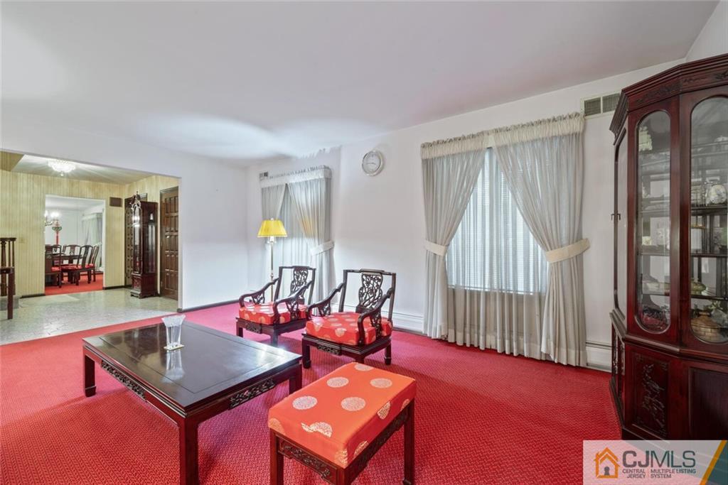 1 Winter Street Edison, NJ 08820 - Photo 7 of 36 a living room with furniture and a window