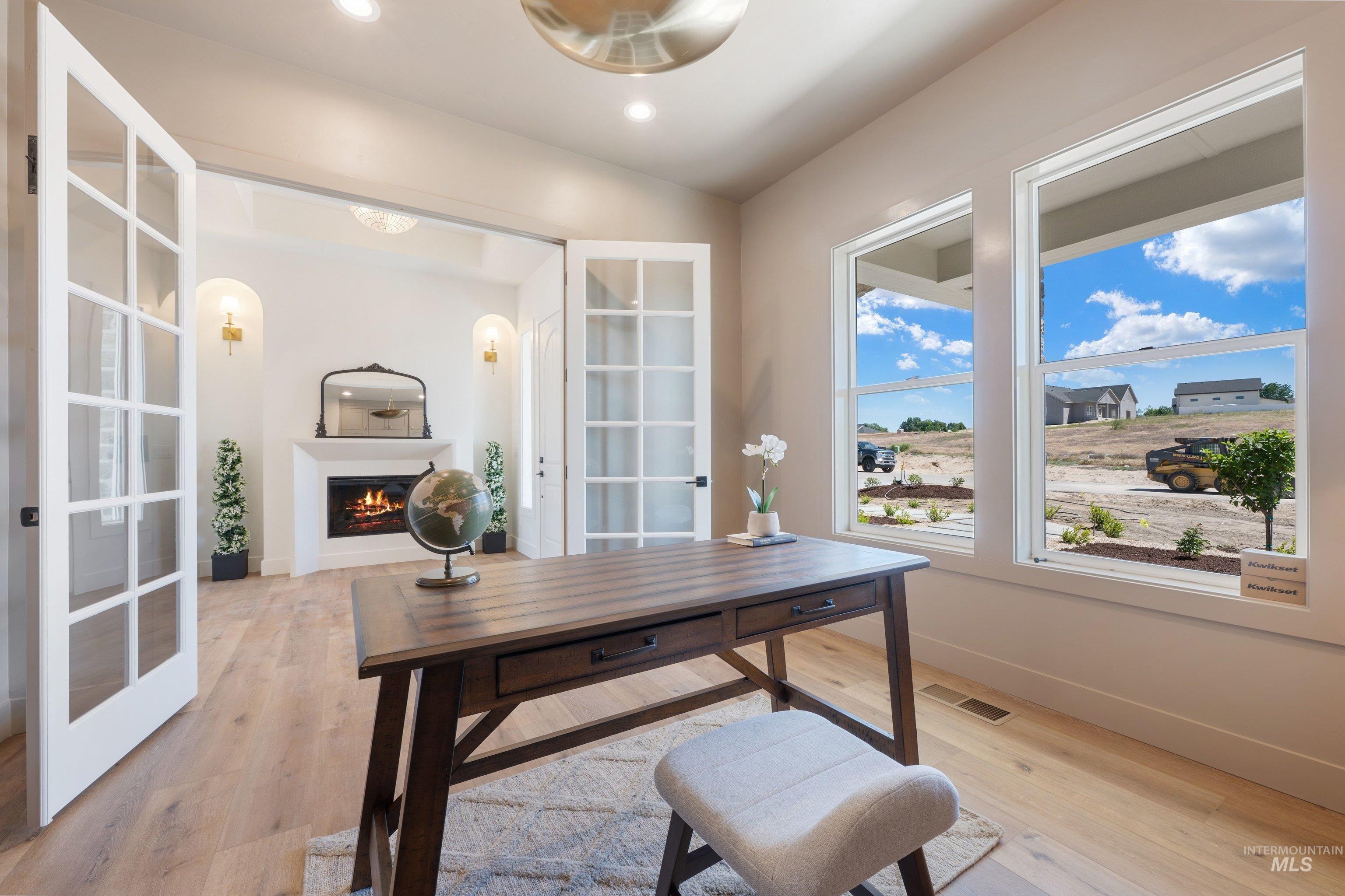 24821 Ardmore Court Caldwell, ID 83607 - Photo 10 of 43 Light wood-finish flooring throughout the space
