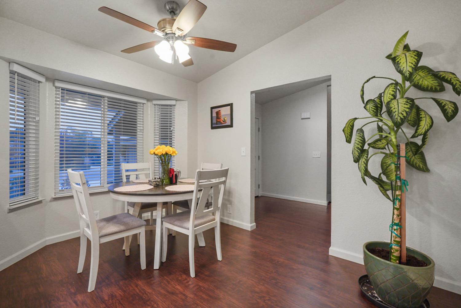 1820 North Berkeley Avenue Turlock, CA 95382 - Photo 11 of 29 a view of a dining room with furniture window and wooden floor