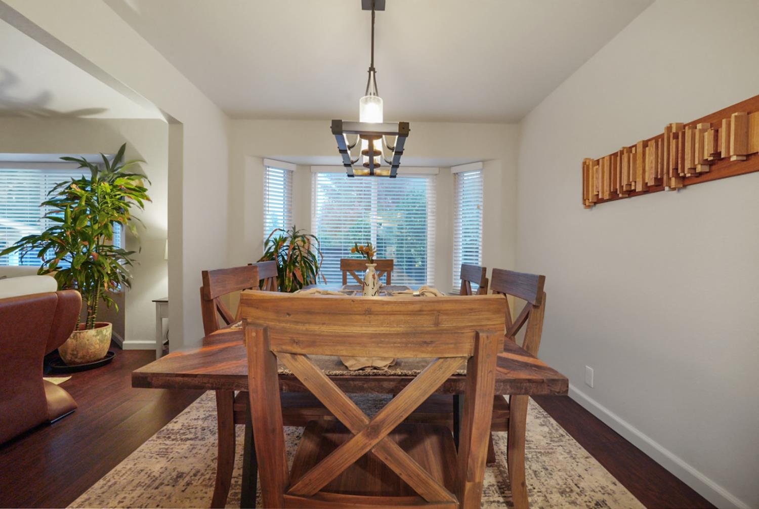 1820 North Berkeley Avenue Turlock, CA 95382 - Photo 12 of 29 a dining room with furniture potted plants and wooden floor