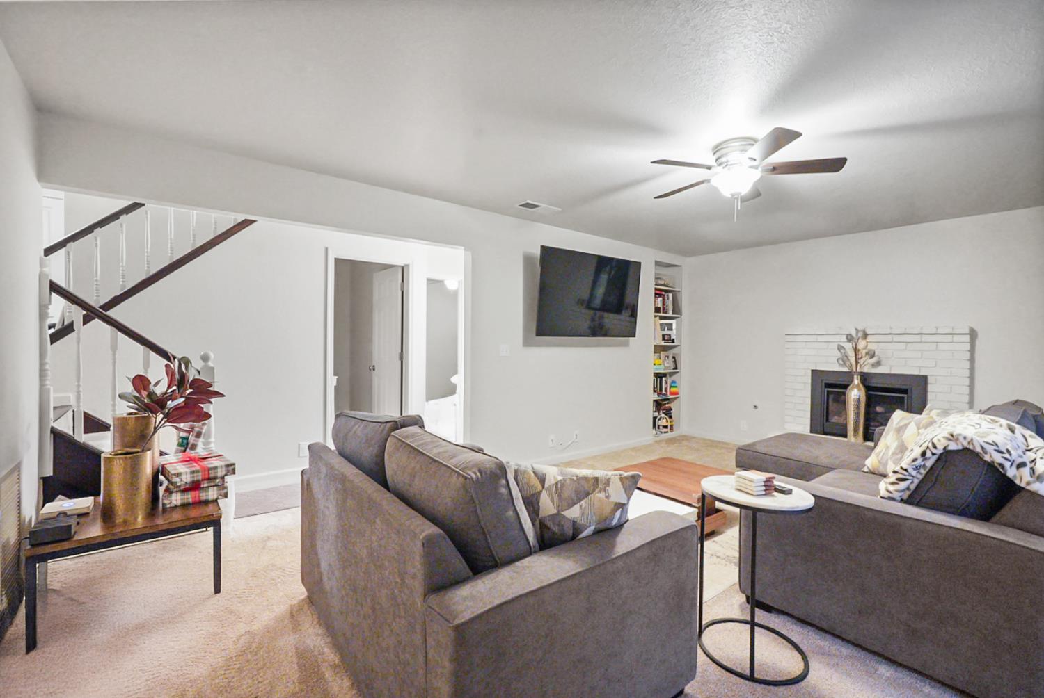1820 North Berkeley Avenue Turlock, CA 95382 - Photo 13 of 29 a living room with furniture and a flat screen tv