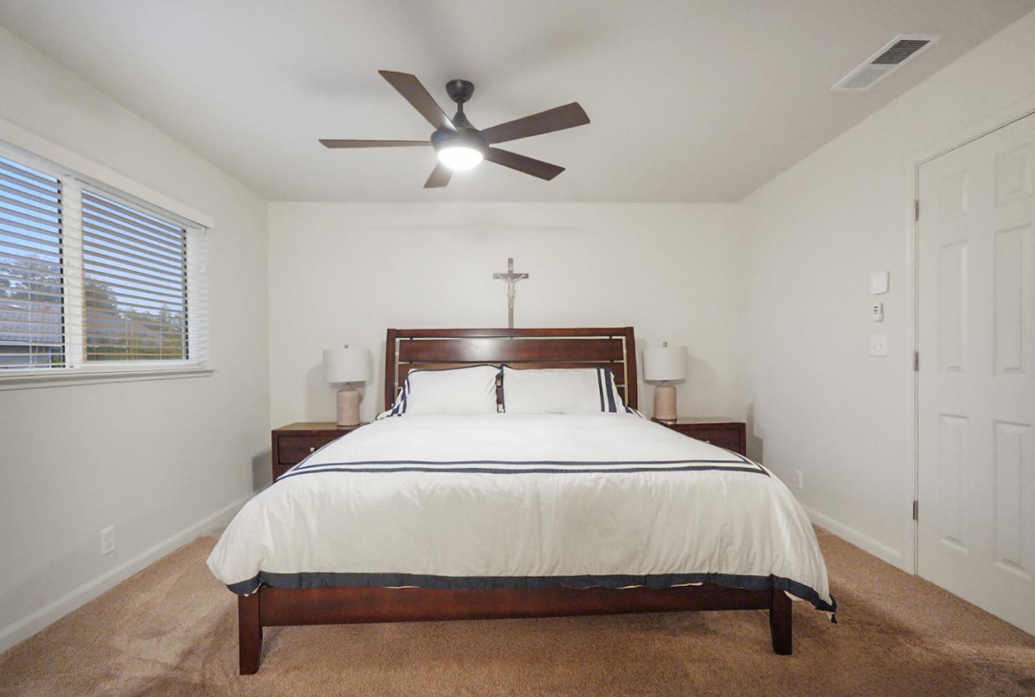 1820 North Berkeley Avenue Turlock, CA 95382 - Photo 16 of 29 a bedroom with a bed and window