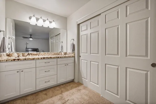 a bed room with a bed and a chandelier